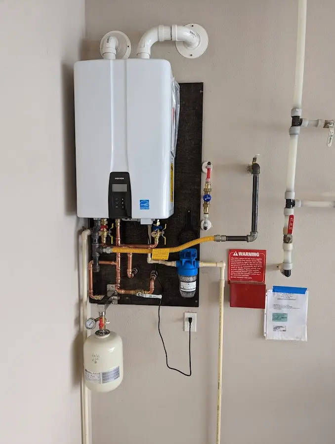 Professional plumber installing copper piping in a Cactus home